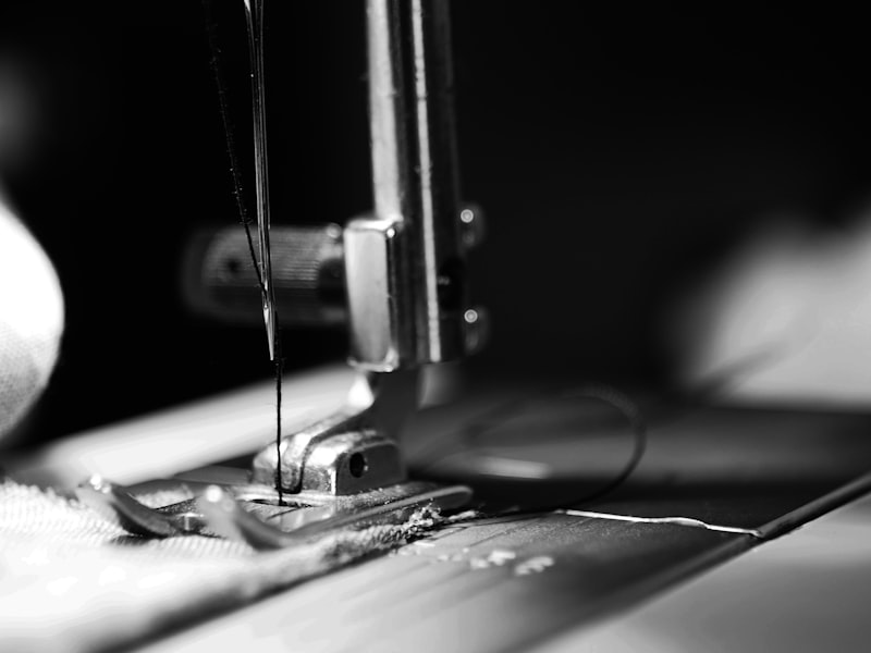 Sewing machine close-up, expert dress alterations at White Rose Bridal