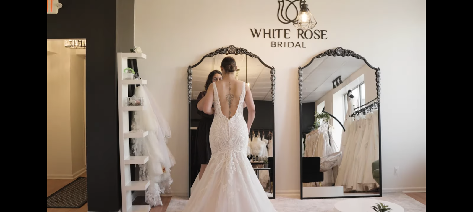 Bride looking in mirror at White Rose Bridal Newark NJ