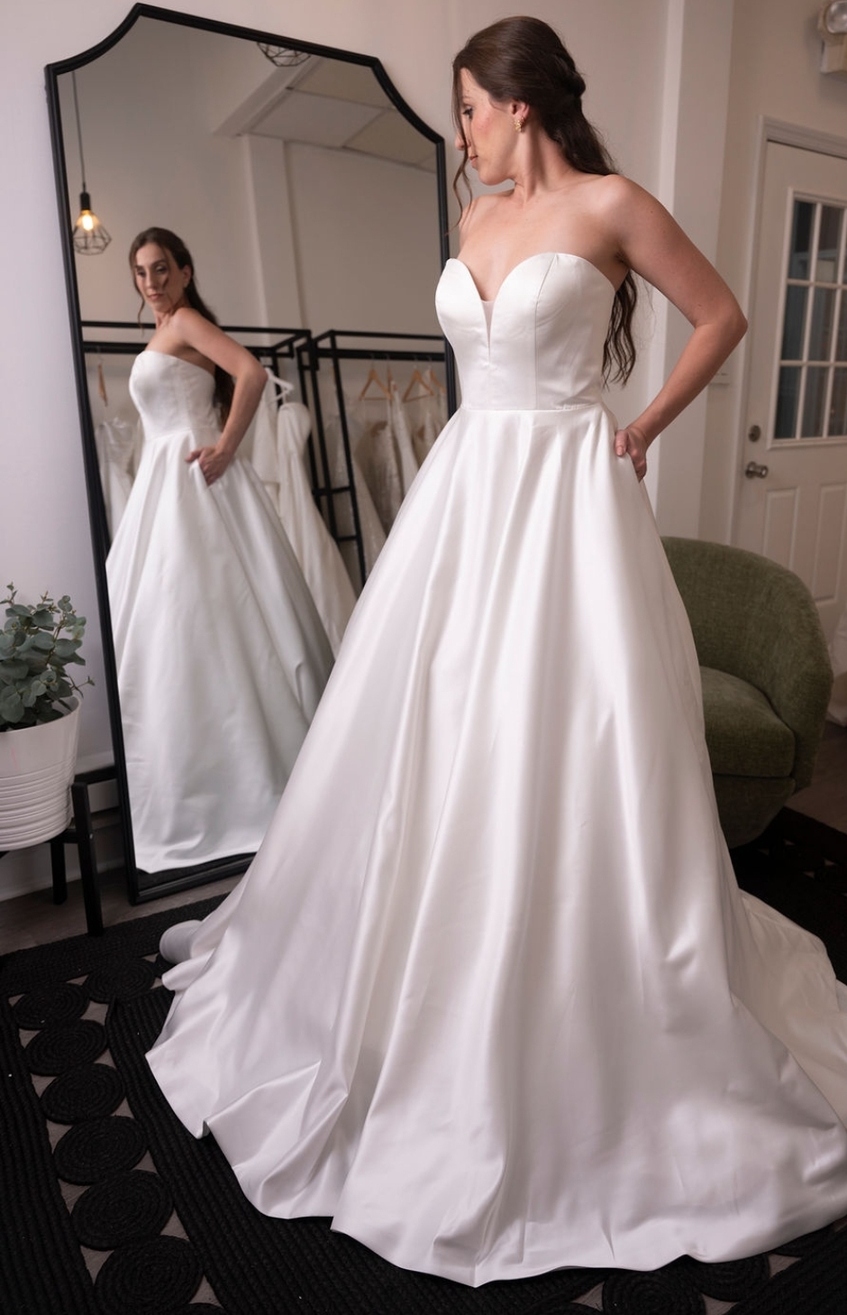 Bride trying on dress at White Rose Bridal